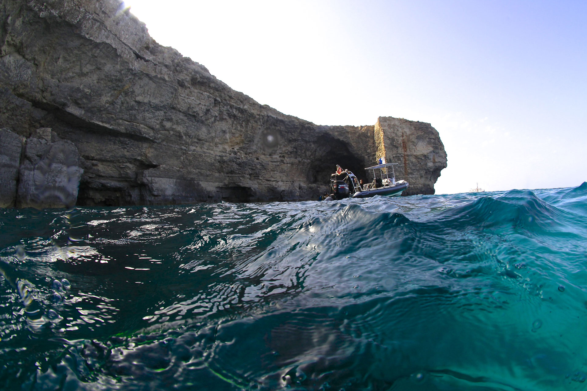 dive boat in front of smugglers cove