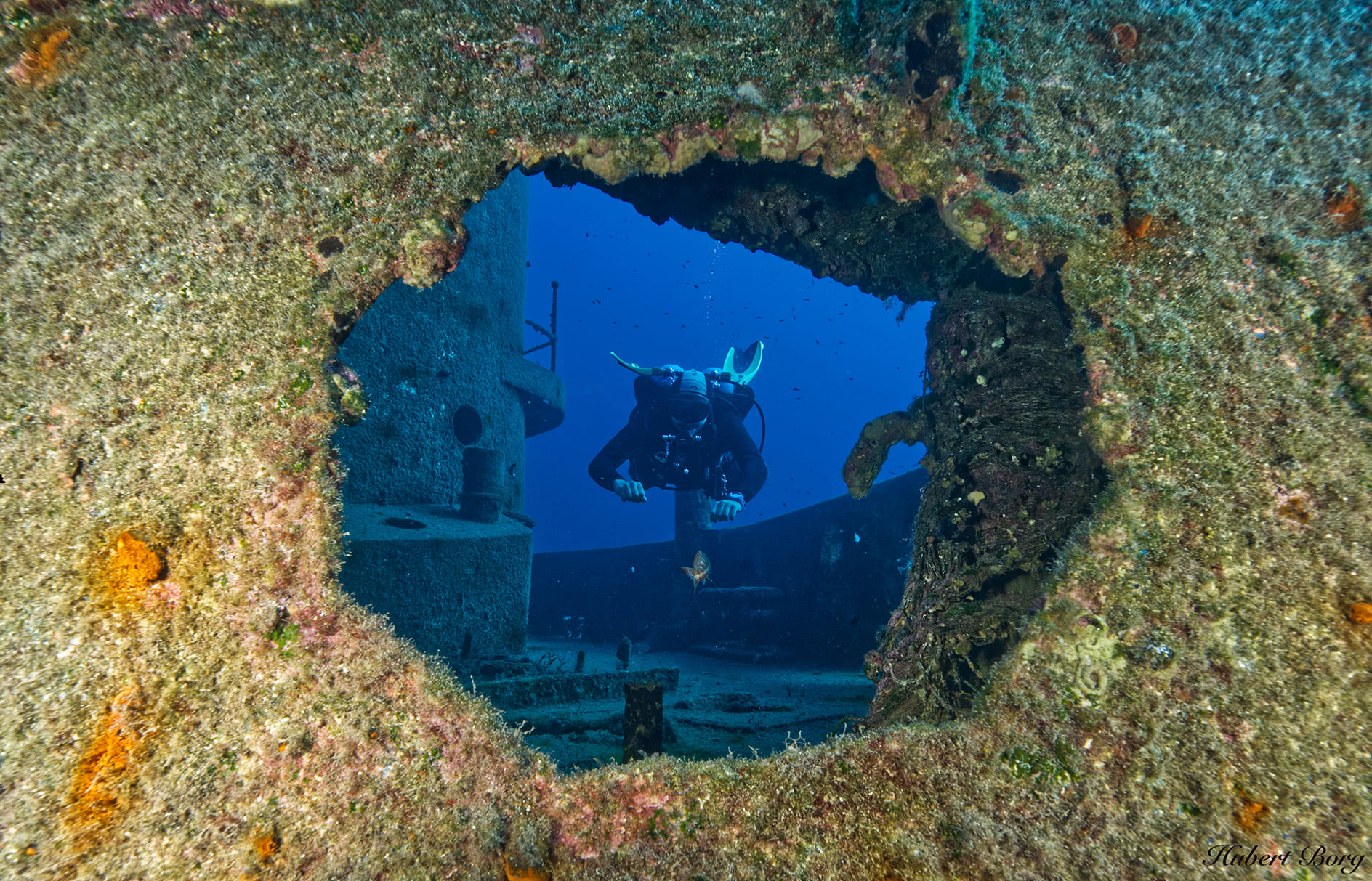 diver hovering over a wreck